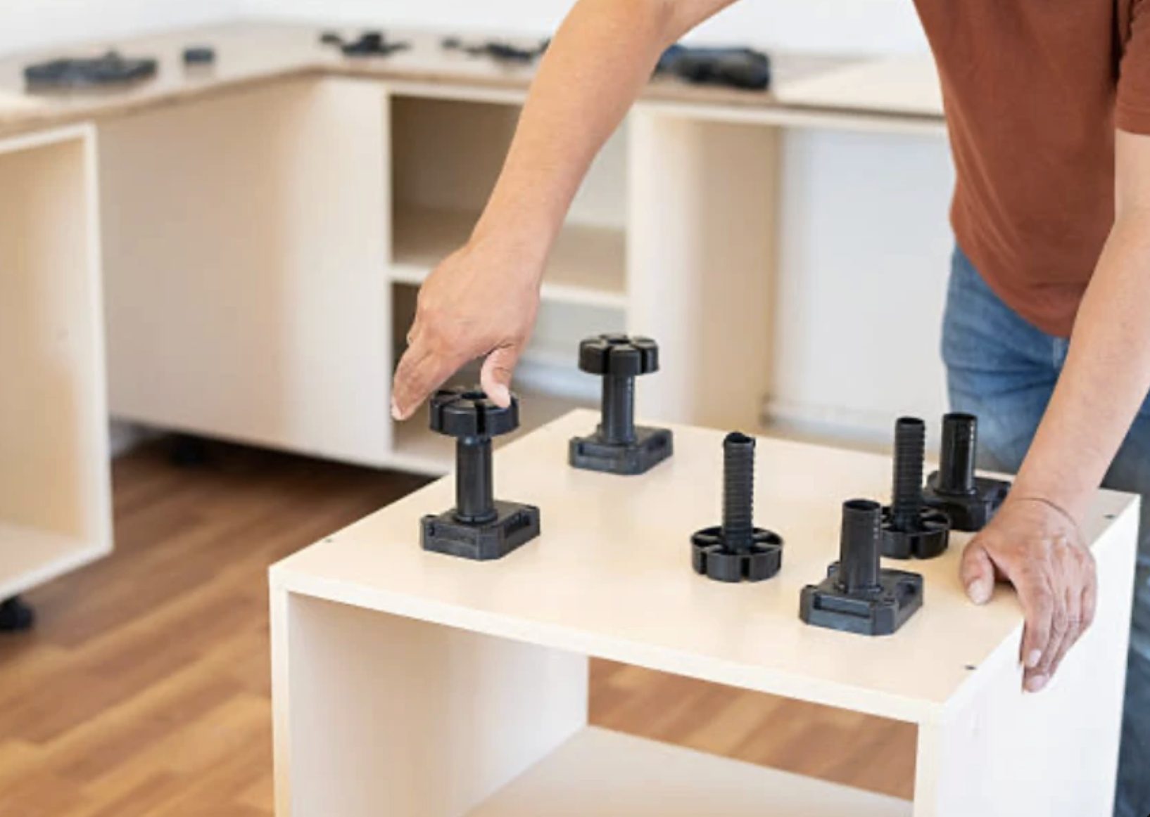 Adjustable legs used to level IKEA base units