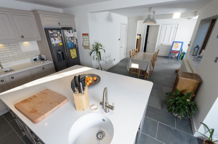 Shaker kitchen island with round sink, American fridge-freezer and slate floor